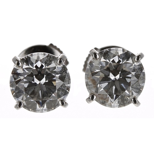 506 - A fine pair of Cartier 18ct white gold  diamond stud earrings with GIA certificates, round brilliant... 