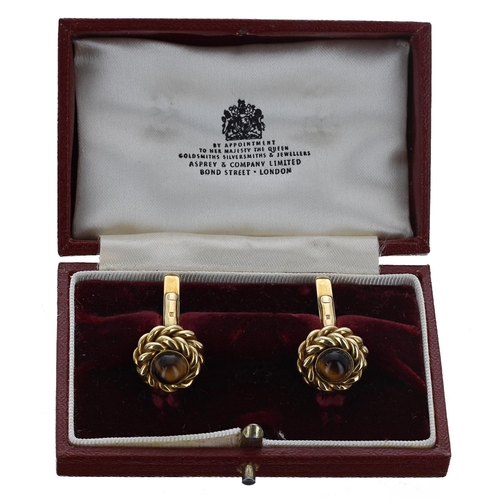 123 - Pair of 18ct 'tiger's eye' cufflinks, London 1977, 20gm, 15.5mm diameter, within an Asprey box... 