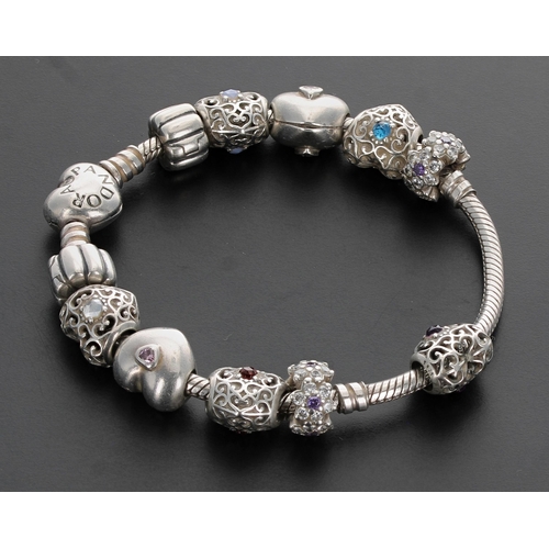 210 - Pandora silver bracelet with ten assorted charms, 36.4gm