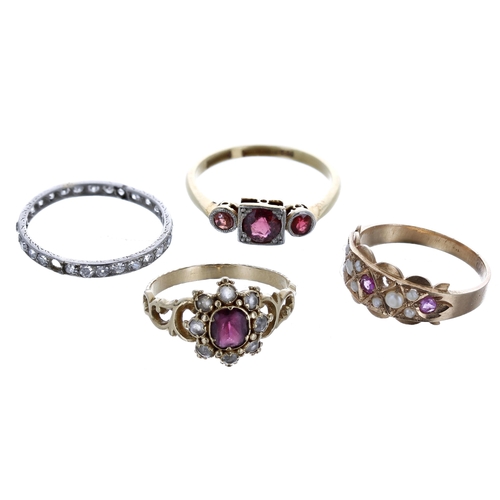 307 - Four assorted antique gold gem set rings, the garnet three stone ring hallmarked '18ct and plat', 8.... 