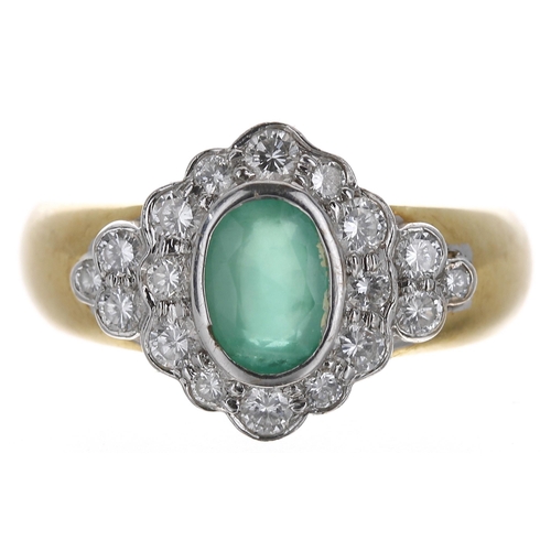 308 - 18ct emerald and diamond oval cluster ring, the emerald 0.70ct approx, set in white metals in a surr... 