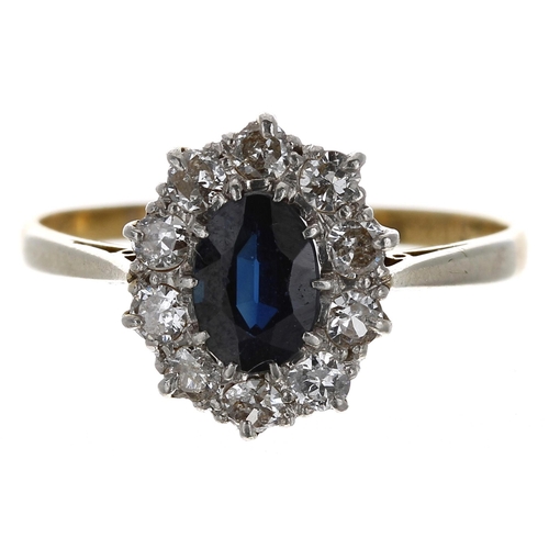 327 - 18ct yellow gold oval sapphire and diamond cluster ring, the sapphire 0.75ct approx, in a border of ... 