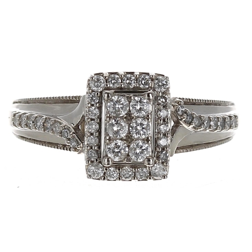 245 - Attractive 9ct white gold diamond cluster ring with set shoulders, 0.32ct in total, width 10mm, 3.3.... 