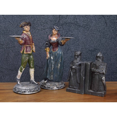 772 - Pair of polychrome and silvered figures, modelled as a lady and gentleman in period dress, 11