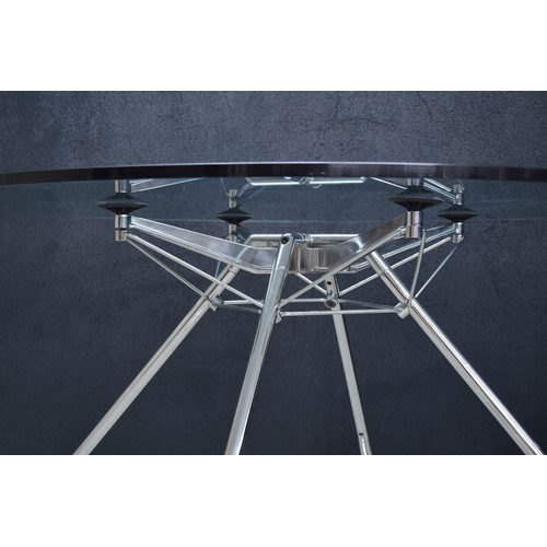 689 - Sir Norman Foster for Tecno, 'Nomos' circular table, the glass top on a chrome plated steel tubular ... 