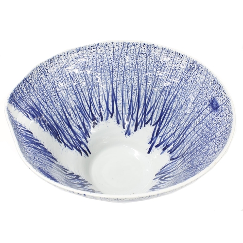 645 - Impressive large studio pottery bowl, decorated with blue trees with nests with a clearing to the in... 