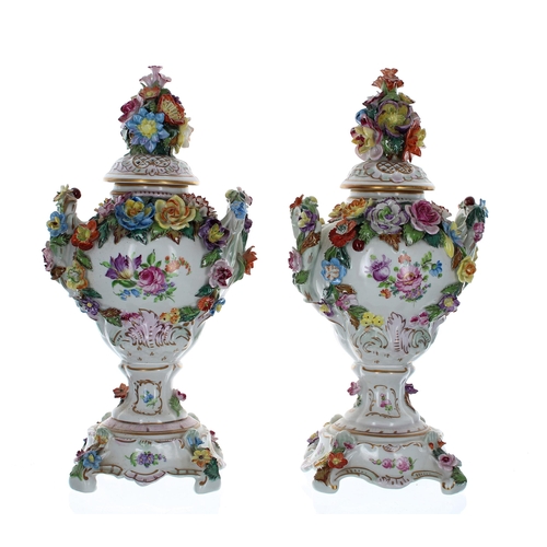 1234 - Pair of Dresden Potschappel porcelain vases with covers, the covers having floral encrusted knobs, t... 