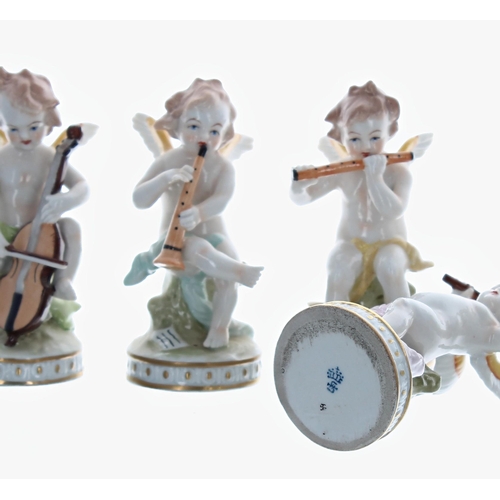 1218 - Set of seven Sitzendorf porcelain cherub band figures, playing various musical instruments, bearing ... 