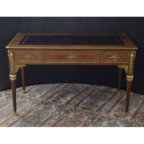 1293 - Good French style bureau plat in the Louis XVI manner, the leather inset leather top over three frie... 