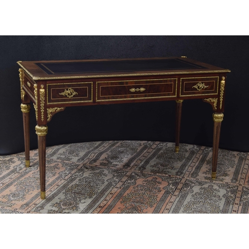 1293 - Good French style bureau plat in the Louis XVI manner, the leather inset leather top over three frie... 