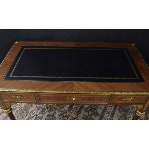 1293 - Good French style bureau plat in the Louis XVI manner, the leather inset leather top over three frie... 