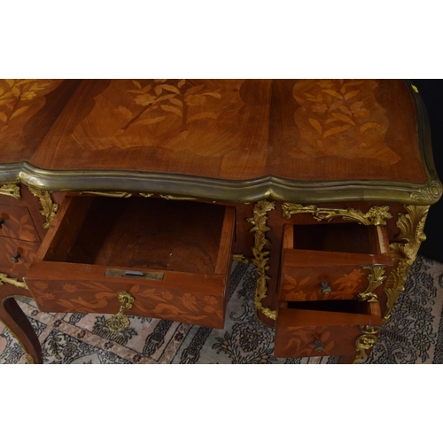 1294 - French Louis XV style marquetry kingwood bureau plat applied with cast gilt metal, with five drawers... 