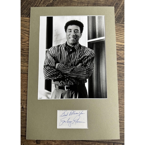 562 - Smokey Robinson - autograph in blue pen on paper, mounted beneath a black and white photograph of th... 