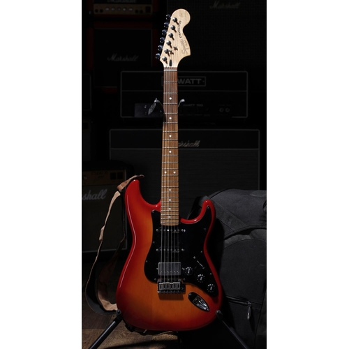 674 - 2003 Squier by Fender Standard Series Stratocaster electric guitar, made in China; Body: cherry sunb... 