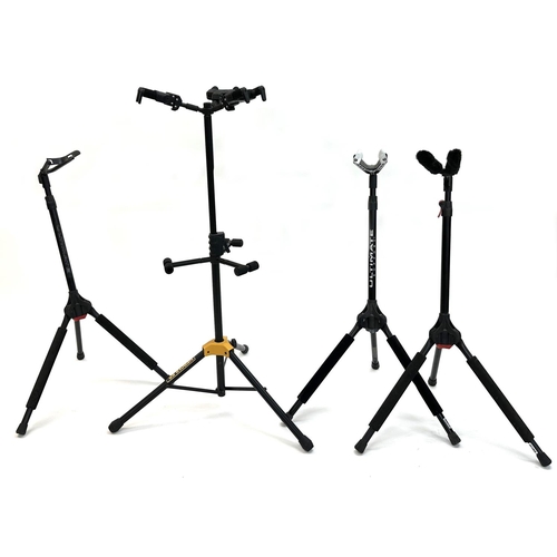 1413 - Hercules guitar stand tree to hold three guitars; together with three Ultimate folding guitar stands... 