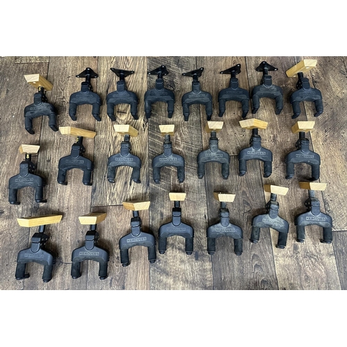 1415 - Approximately twenty Hercules guitar wall hangers