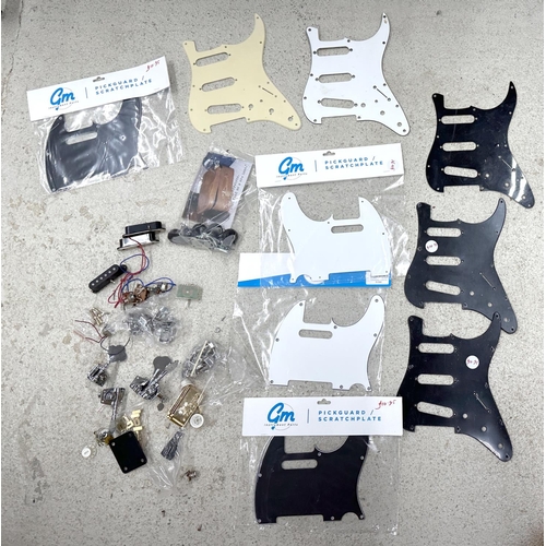 1431 - Selection of guitar spares to include scratchguards for Strat and Tele (mainly new) and a selection ... 