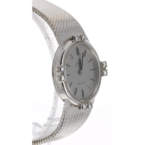 16 - Omega De Ville 18ct white gold oval lady's wristwatch, striped silvered oval dial with applied baton... 