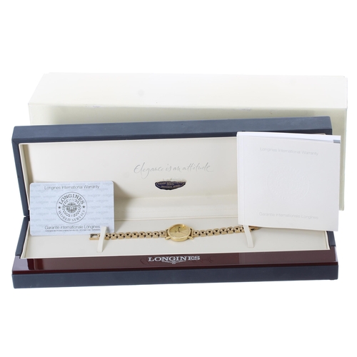 65 - Longines 18ct lady's wristwatch, reference no. L4 277 6, circular champagne dial with applied baton ... 