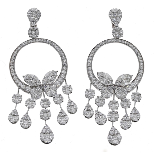 442 - A fine pair of white gold chandelier drop earrings, set with round, marquise and princess-cuts, Omeg... 