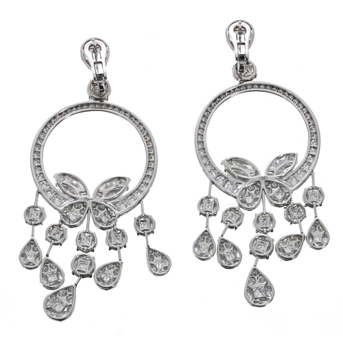 442 - A fine pair of white gold chandelier drop earrings, set with round, marquise and princess-cuts, Omeg... 