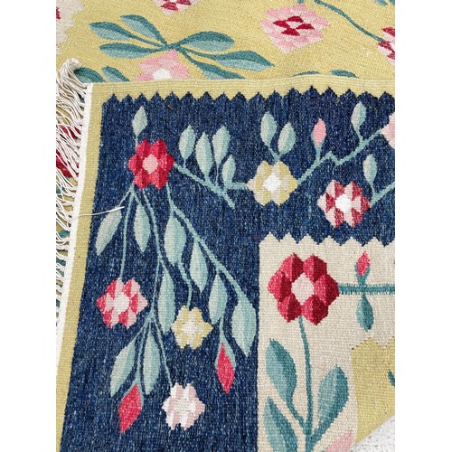 1129 - Decorative floral Kilim type rug, decorated with pink flowers and foliage within floral and foliat e... 