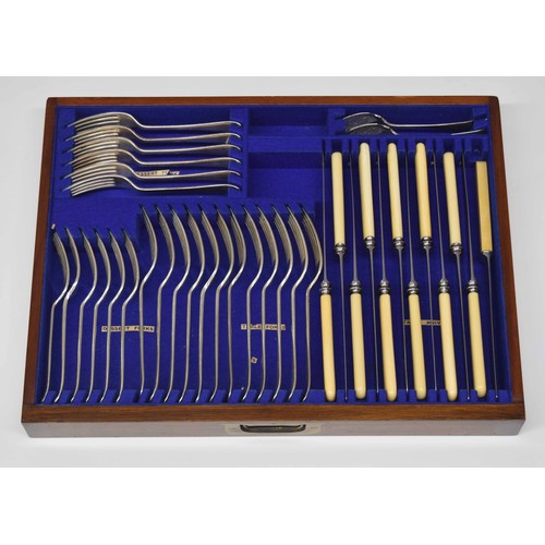 884 - Good near complete canteen of plated flatware, presented in an oak campaign type chest with hinged c... 