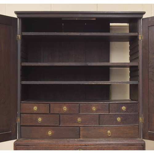 1140 - Welsh 18th century oak secretaire cupboard, the two panelled cupboard doors enclosing a shelved inte... 