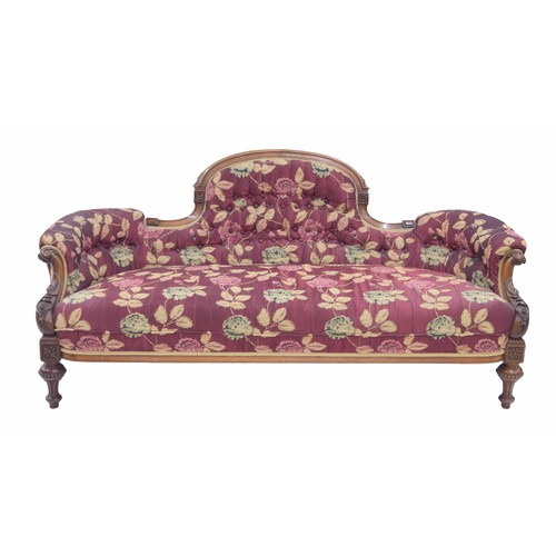 1137 - Victorian walnut salon settee, the shaped curved button upholstered back over a stuff-over upholster... 