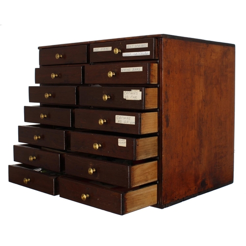 498 - Fourteen drawer wooden chest containing a large quantity of watchmakers parts to include Omega parts... 