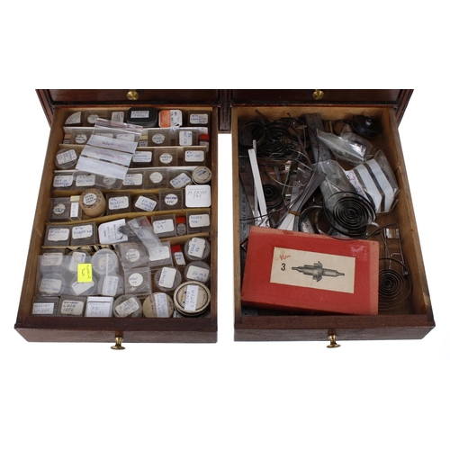 498 - Fourteen drawer wooden chest containing a large quantity of watchmakers parts to include Omega parts... 