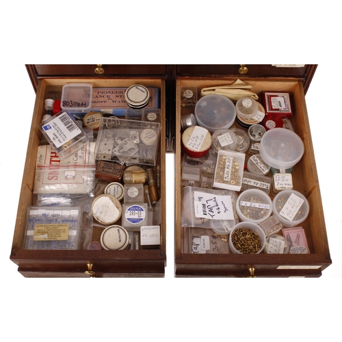 498 - Fourteen drawer wooden chest containing a large quantity of watchmakers parts to include Omega parts... 