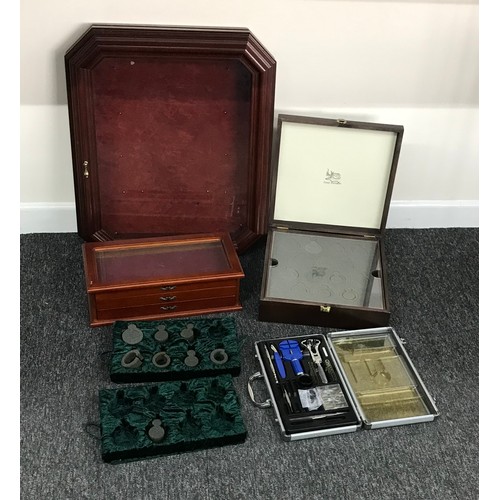 1056 - Carry case containing a quantity of watchmakers tools to include a case opener, case knife, strap pi... 