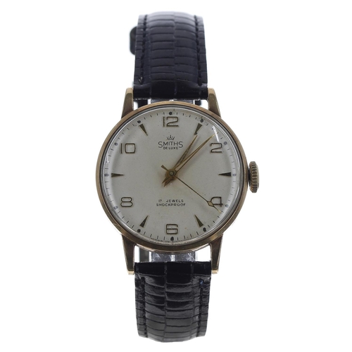 239 - Smiths De Luxe 9ct gentleman's wristwatch, London 1962, circular silvered dial with applied gilt Ara... 