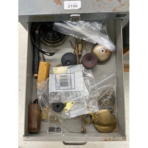 2199 - Small Bisley eight drawer grey metal cabinet containing; a small quantity of clock fittings and keys... 