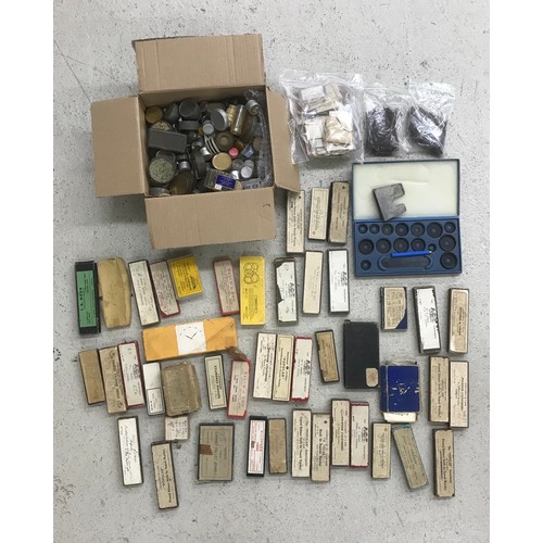 501 - Quantity of watch parts and spares to include balance staffs, winding stems, hands, pallet stones, o... 