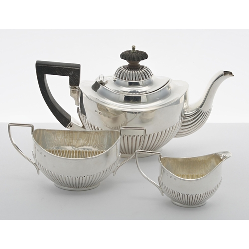 515 - Victorian silver bachelors three piece tea set, of oval form with half gadrooned body, comprising te... 