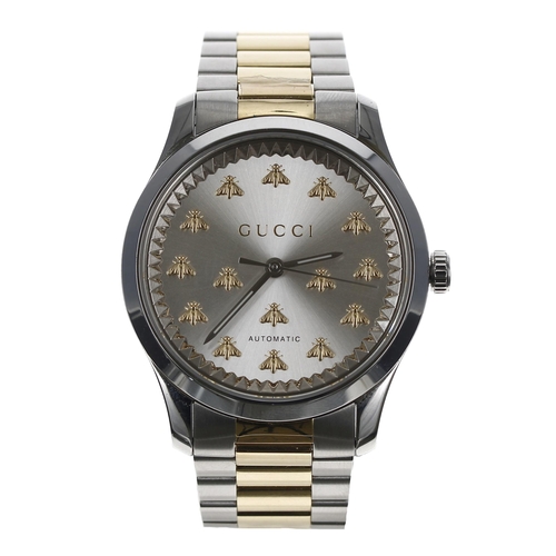 148 - Gucci G-Timeless automatic bicolour wristwatch, reference no. 126.4, silvered dial with applied bee ... 