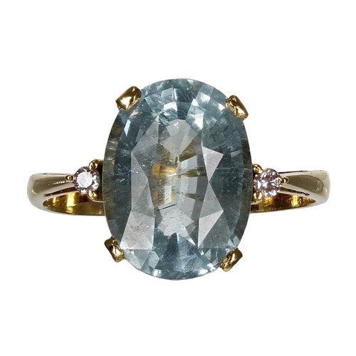 329 - Modern 14ct aquamarine and diamond three stone ring, the oval aquamarine 3.60ct approx, width 12mm, ... 