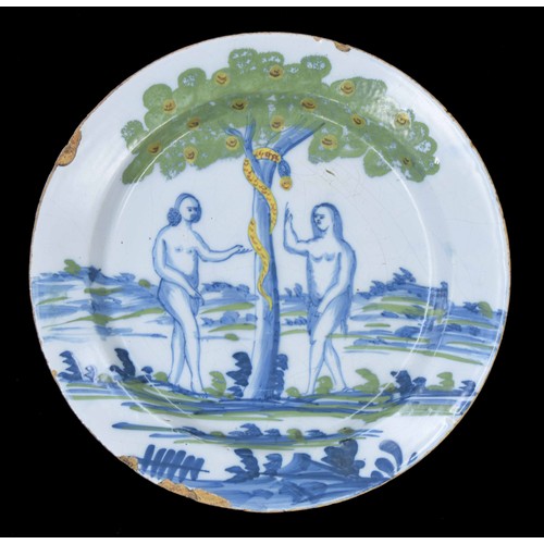 584 - English Delft pottery Adam and Eve plate, possibly Bristol, polychrome decorated with blue figures b... 