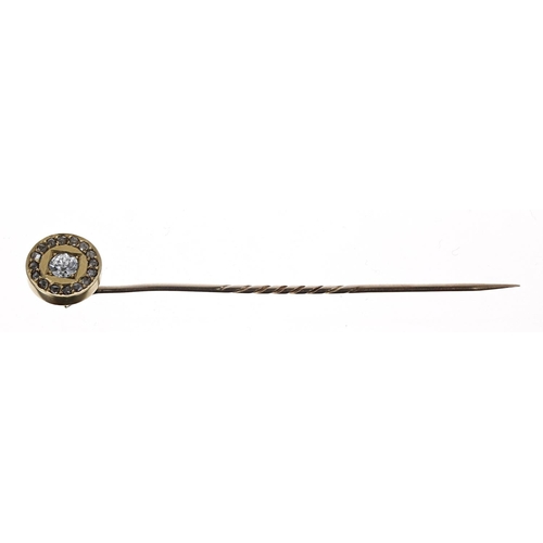 332 - Victorian gold diamond set stick pin, with a round old-cut diamond in a surround of rose-cut diamond... 