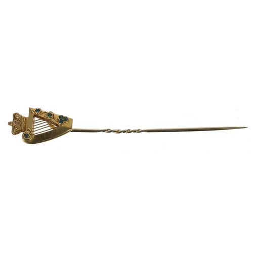 334 - Irish yellow gold harp design stick pin, set with small emeralds, 6.3gm, 88mm long