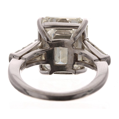 369 - Very fine large platinum emerald-cut  diamond ring with tapered baguette diamond shoulders, 7.60ct, ... 