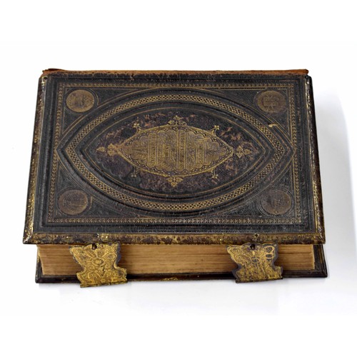 568 - Browns Self-Interpreting Family Bible, with coloured plates, bound in a tooled leather cover having ... 