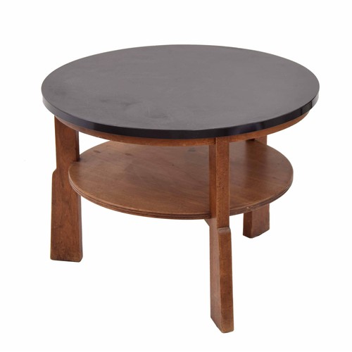 849 - Gordon Russell walnut circular low coffee/book table, the plain top over a circular undertier, raise... 