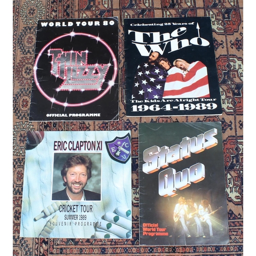 564 - Four souvenir concert programmes to include 1980 Thin Lizzy world tour, 1989 Eric Clapton Cricket to... 