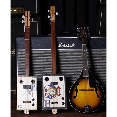 695 - Two Capo Custom three string electric cigar box guitars; also a Gear4Music mandolin, gig bag (3)... 