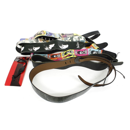 1299 - Eight various unused guitar straps to include three Beatles picture straps; together with a D'Addari... 