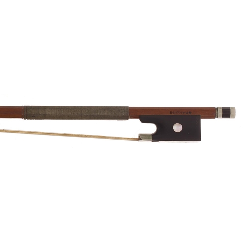 2221 - French JTL three-quarter size nickel mounted violin bow stamped Grandini, the stick round, the ebony... 