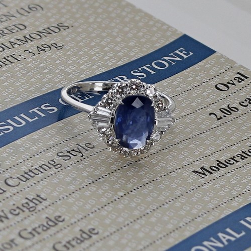 10 - Good certificated 18ct white gold ring, set with an oval-cut sapphire surrounded by round brilliant ... 